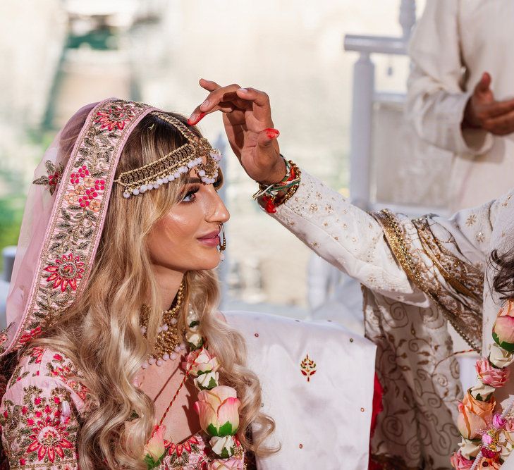 Intimate Hindu wedding ceremony at the boathouse in Euridge Manor