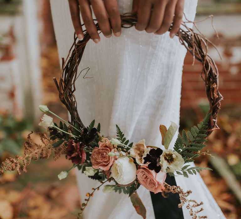 Autumn hoop bouquet with twigs and flowers 