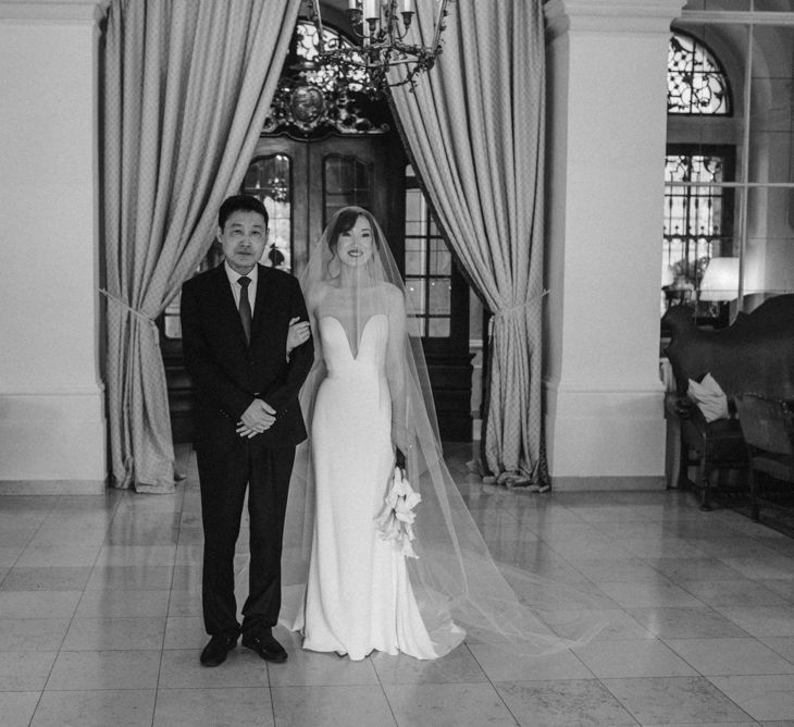 Father of the bride and daughter about to walk down the aisle 