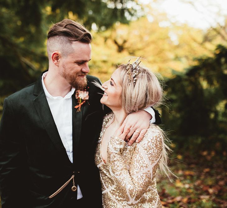 Couple in woodland shoot with bride in sequinned dress. Photography by Maryanne Weddings.