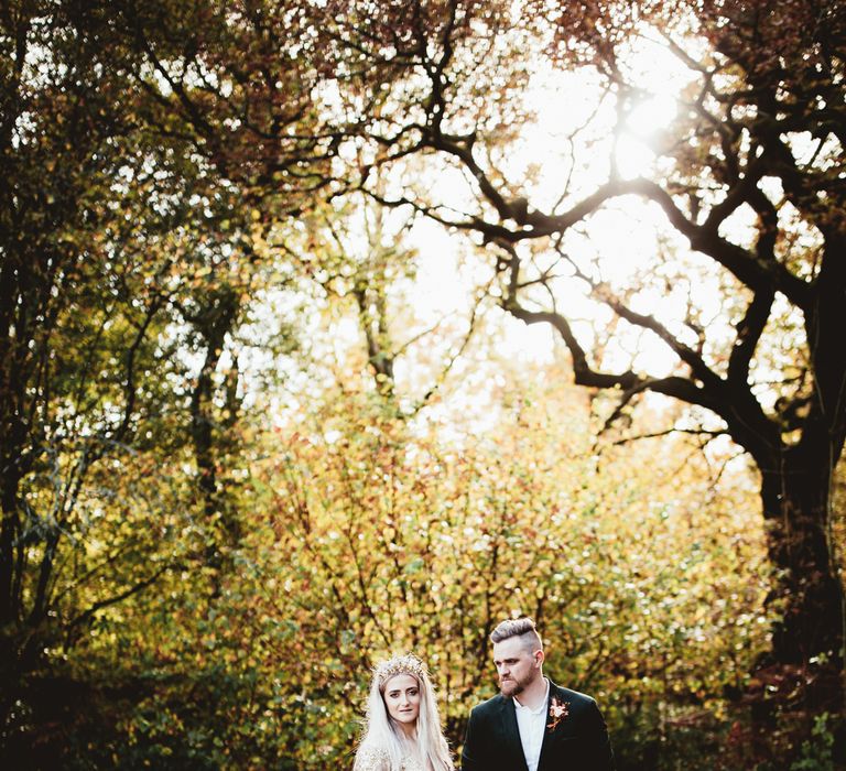 Bride and groom in couples shoot in the woods. Photography by Maryanne Weddings.