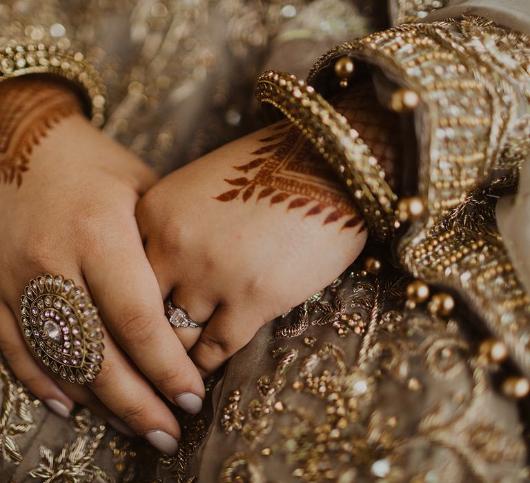 Muslim bride with henna and gold jewellery 