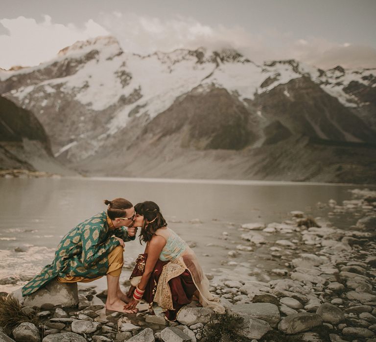 The bride and groom embrace during their Punjabi wedding ritual