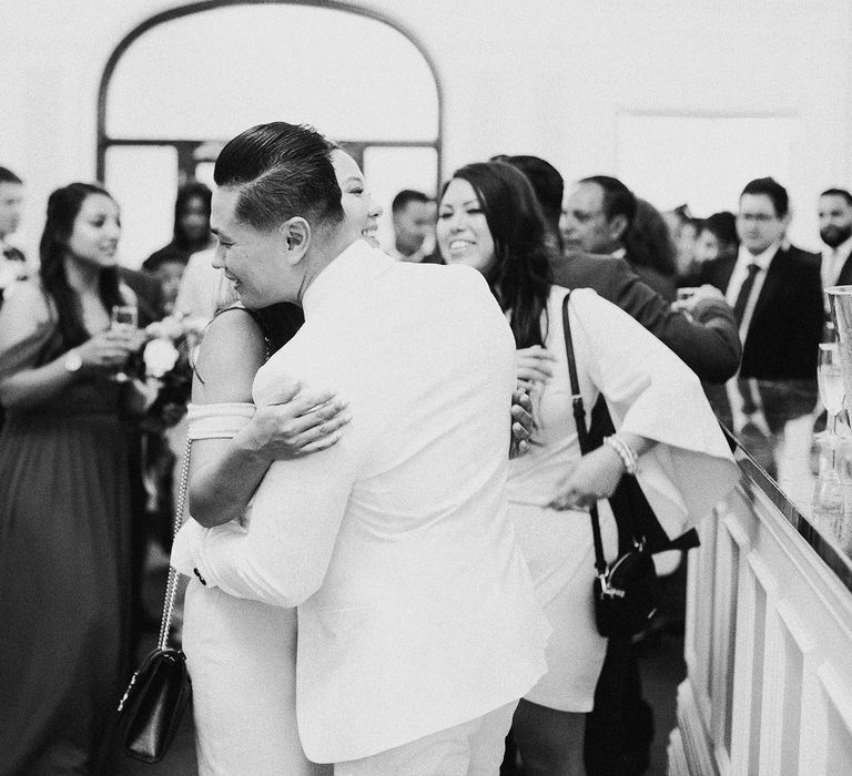 Black & white image of groom and wedding party