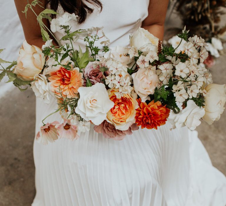 Orange, blush pink and white wedding bouquet for a white and gold wedding theme