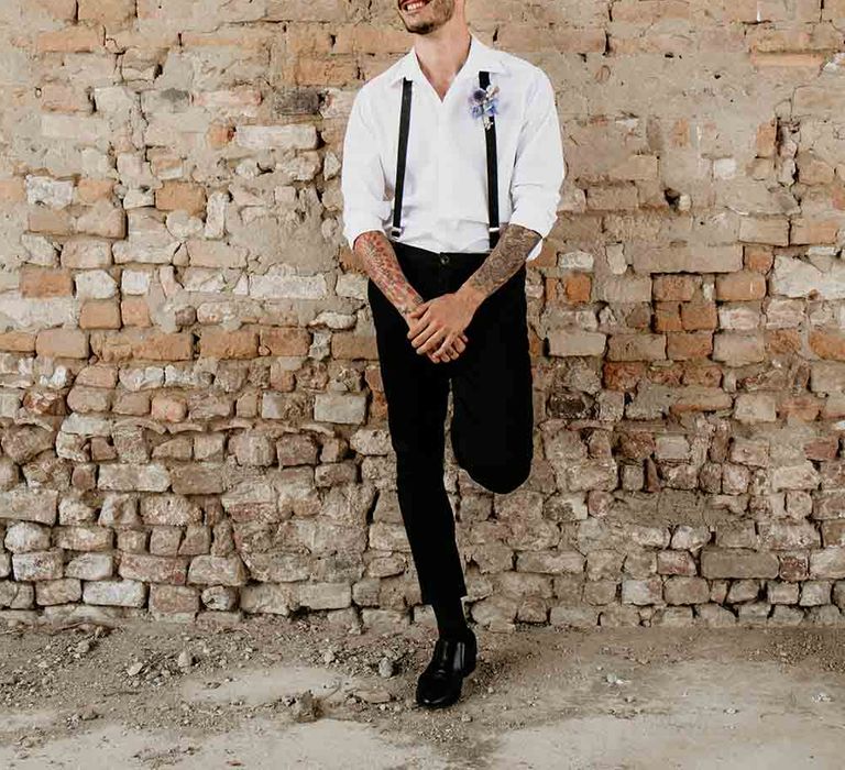 Groom in braces and buttonhole