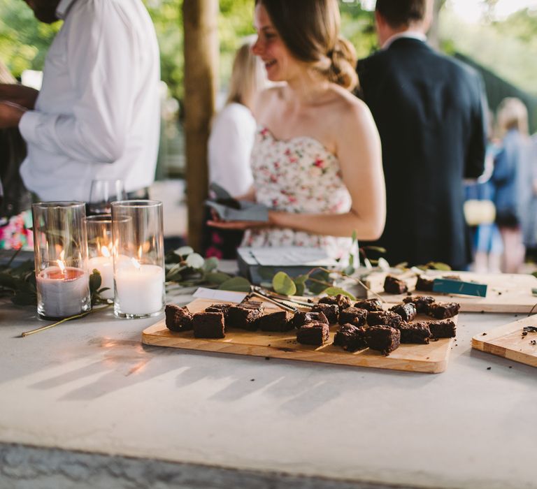 Brownies on wooden boards during wedding reception