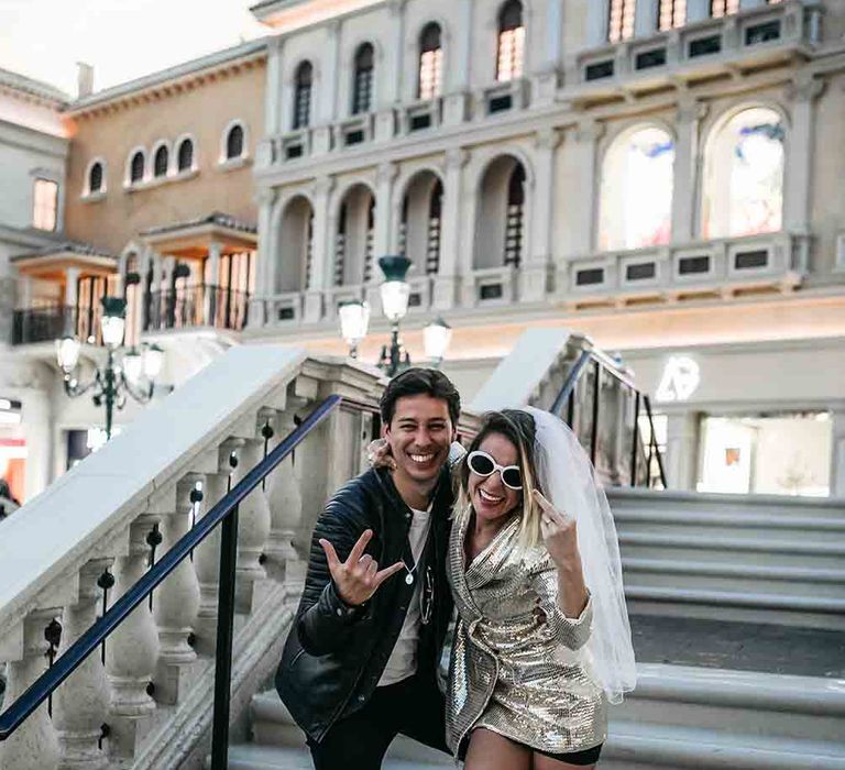 Las Vegas wedding for bride in gold wedding dress and thrift shop wedding jacket for groom