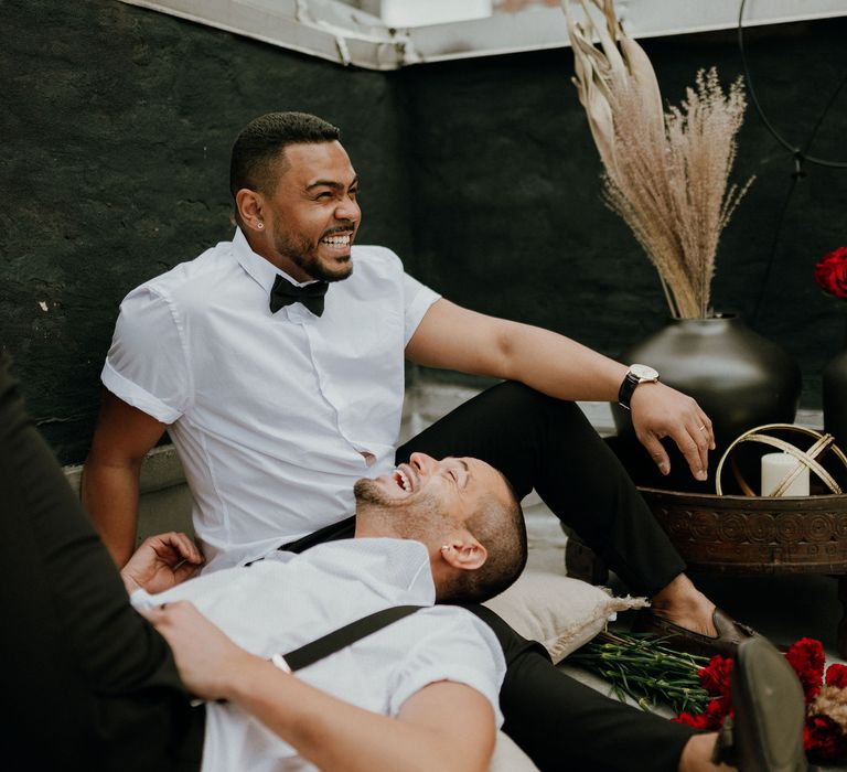 Grooms share a smile at intimate gay wedding New York 