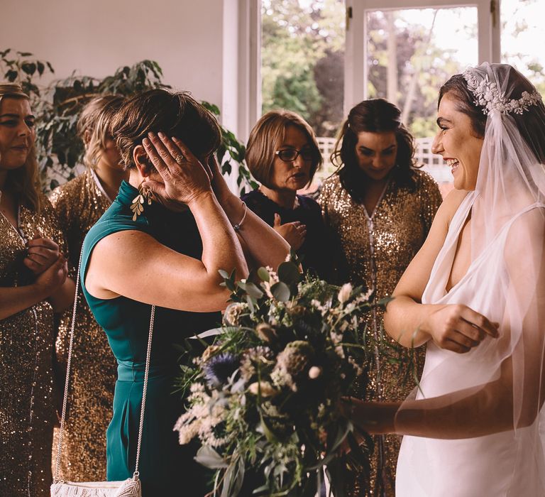 Wedding morning bridal party first look with bride in a Juliet cap veil 