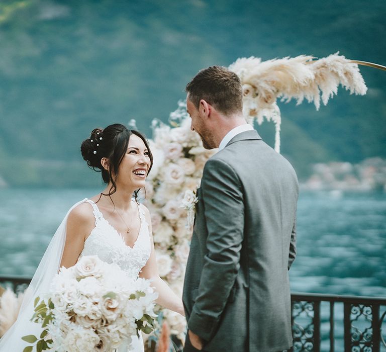 Bride looks lovingly at her groom on her wedding day at the Villa Balbiano 