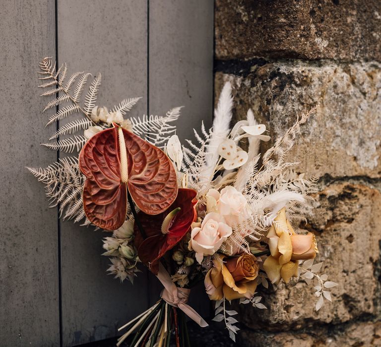 Rustic bridal bouquet with dried flowers, roses and ferns for summer wedding in Dorset