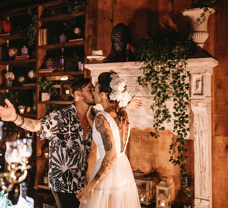 Groom wears patterned shirt on wedding day for reception