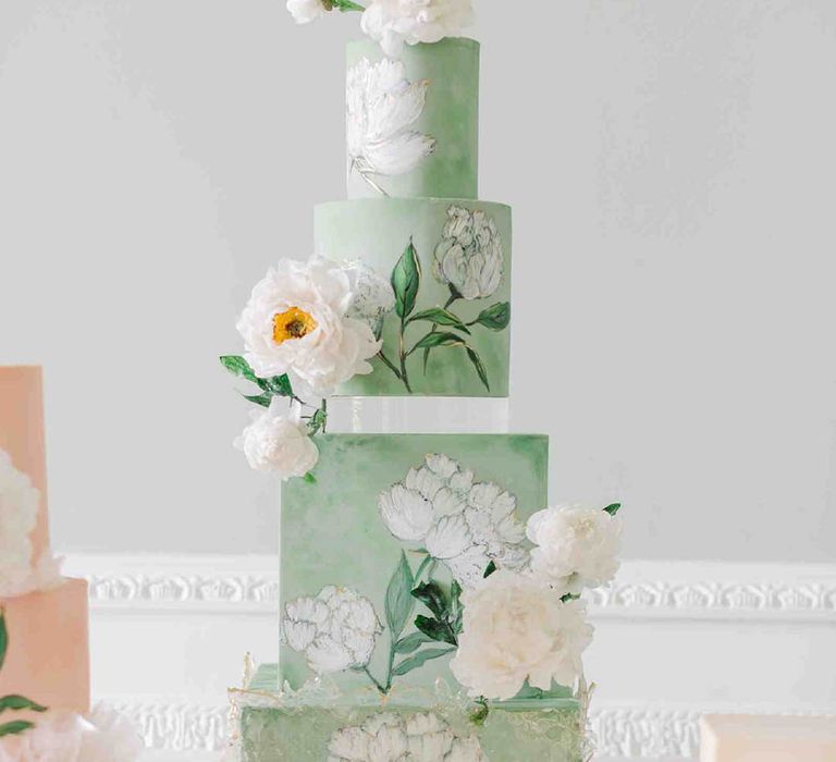 Pale green wedding cake with square and round tiers and white peony flower illustration 