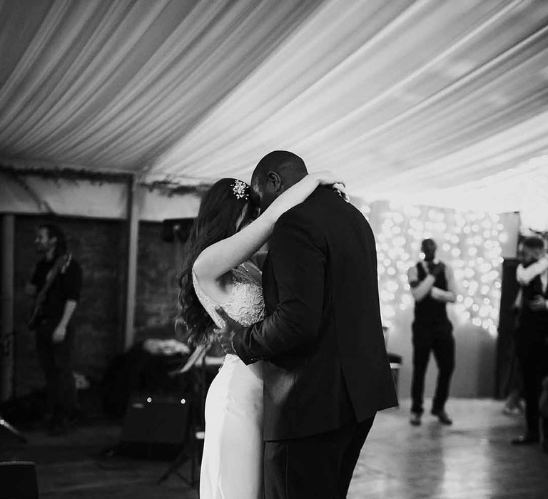 Bride in sequin dress dances with Groom