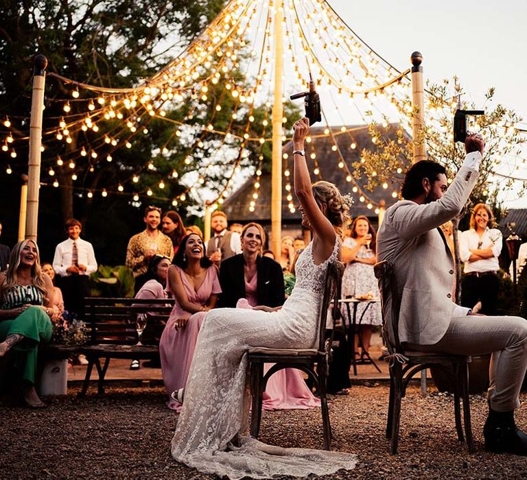 Mr & Mrs Game played outdoors at Preston Court with hanging festoon lights 