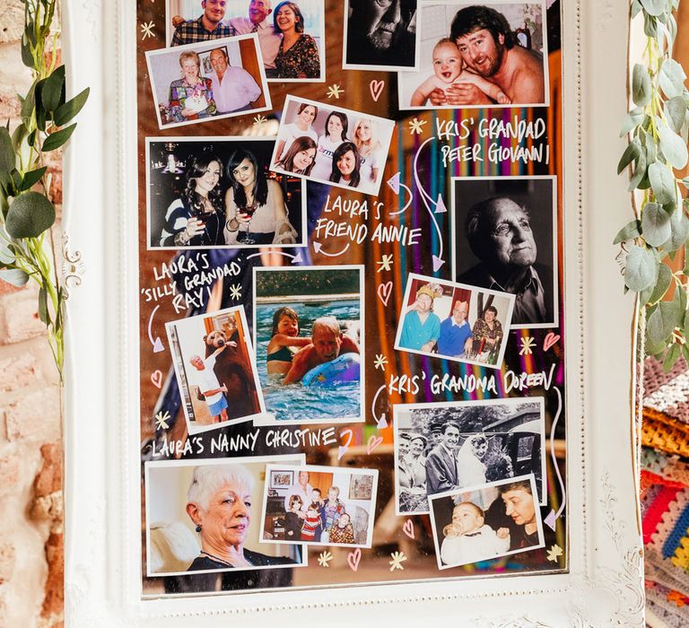 Remembrance wedding mirror on easel with photos, leaf garland and sign reading 'wish you were here'