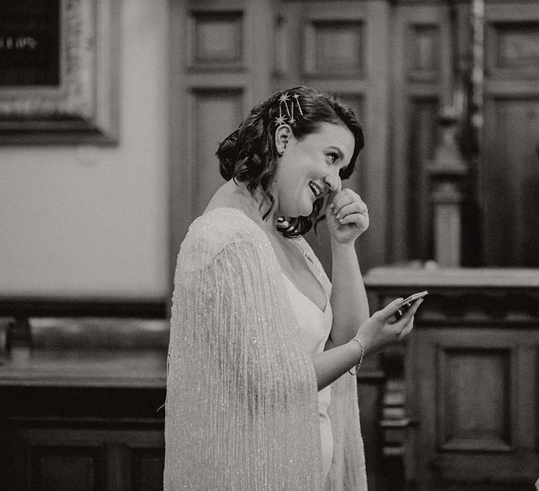 Bride becomes emotional on her wedding day in black & white image