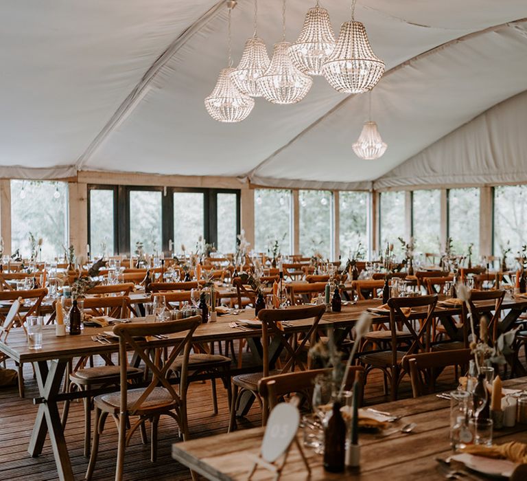 The Copse Country house wedding reception with dried orange flower centrepiece decor 