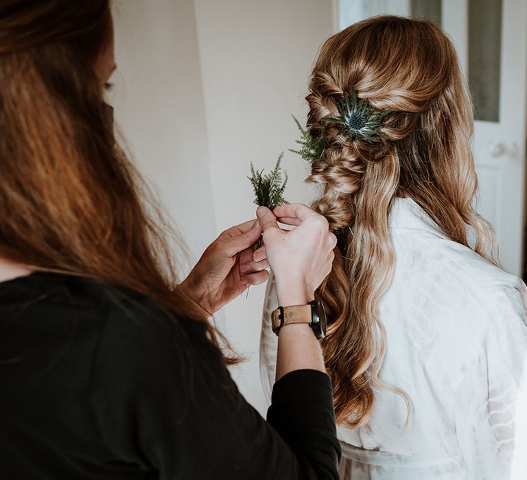 Bride wears her blonde hair in loose waves on her wedding day