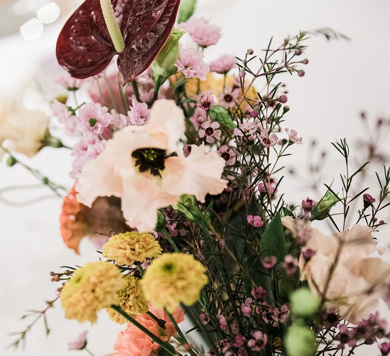 Wedding flowers of pinks and reds in tin can 