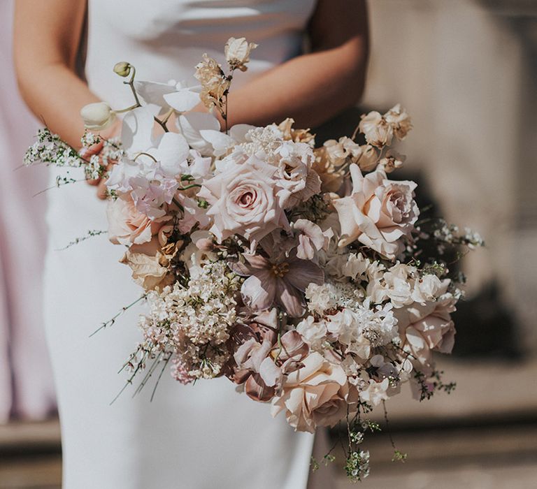 Bride's white, neutral and pink rose wedding bouquet for romantic wedding 