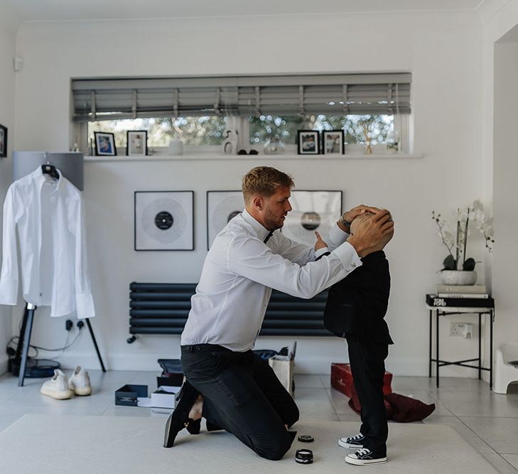 Groom does his sons hair in intimate moment 