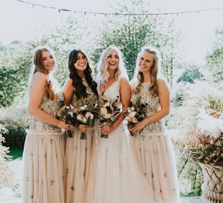 Boho relaxed wedding with the bridesmaids in embroidered dresses