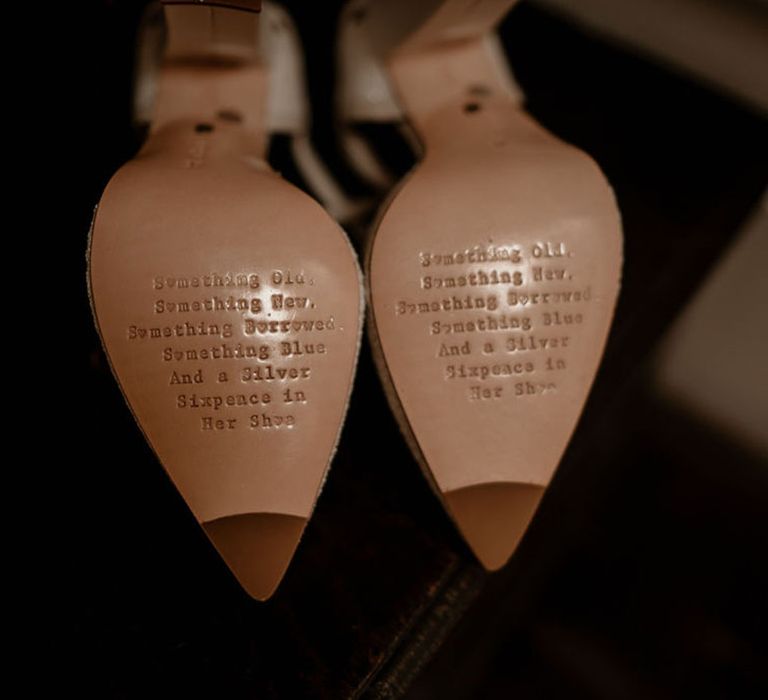 Charlotte Mills wedding shoes with engraved saying on the sole of the shoes 