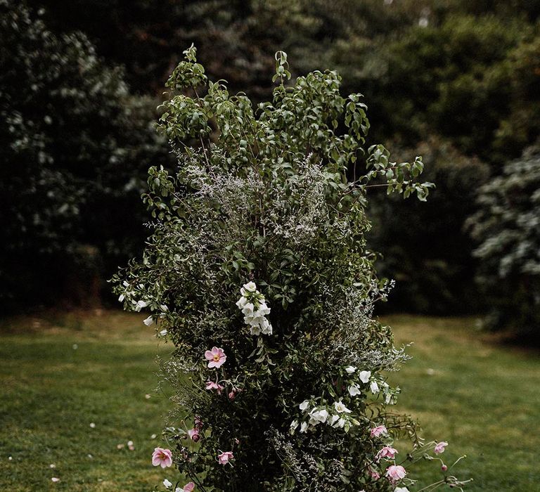 Natural wildflower wedding flower column with pink and white flowers including bellflower for Cornwall wedding 