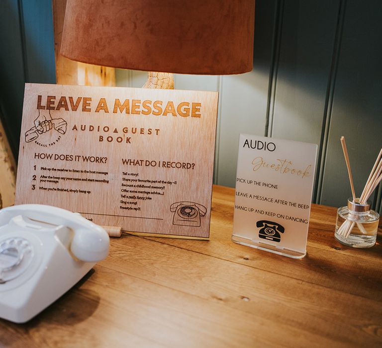 White vintage telephone for the audio guestbook idea as an alternative to traditional guest books 