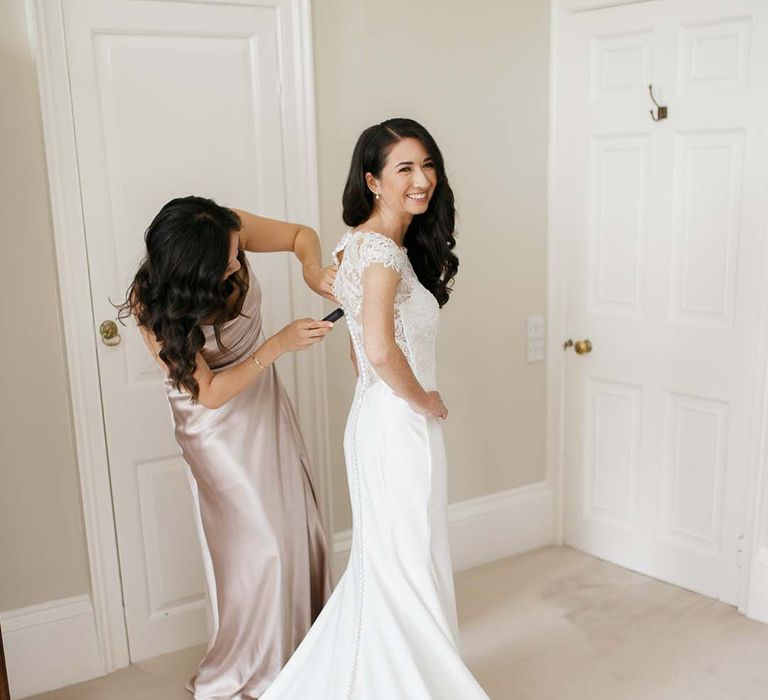 Wedding morning bridal preparations with bride in a Kelly Faetanini wedding dress