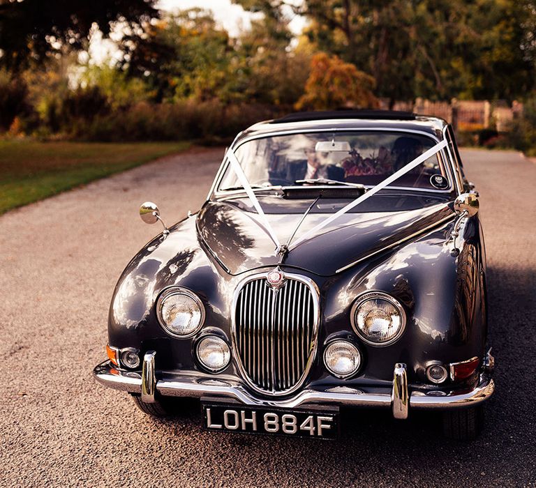 Dark blue wedding car for the bride at their country house wedding 