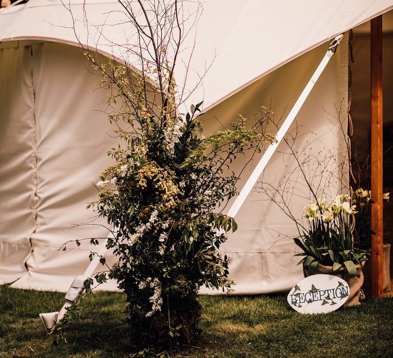 Foliage wedding flower column at marquee wedding for at home wedding 