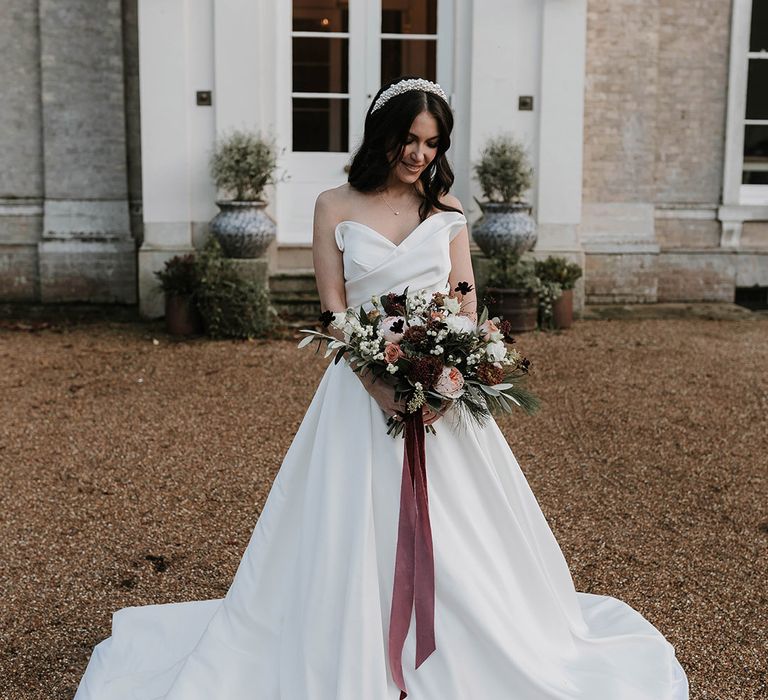 Ripple Court Estate wedding with the bride wearing an off the shoulder princess skirt wedding gown with pearl jewellery and accessories 