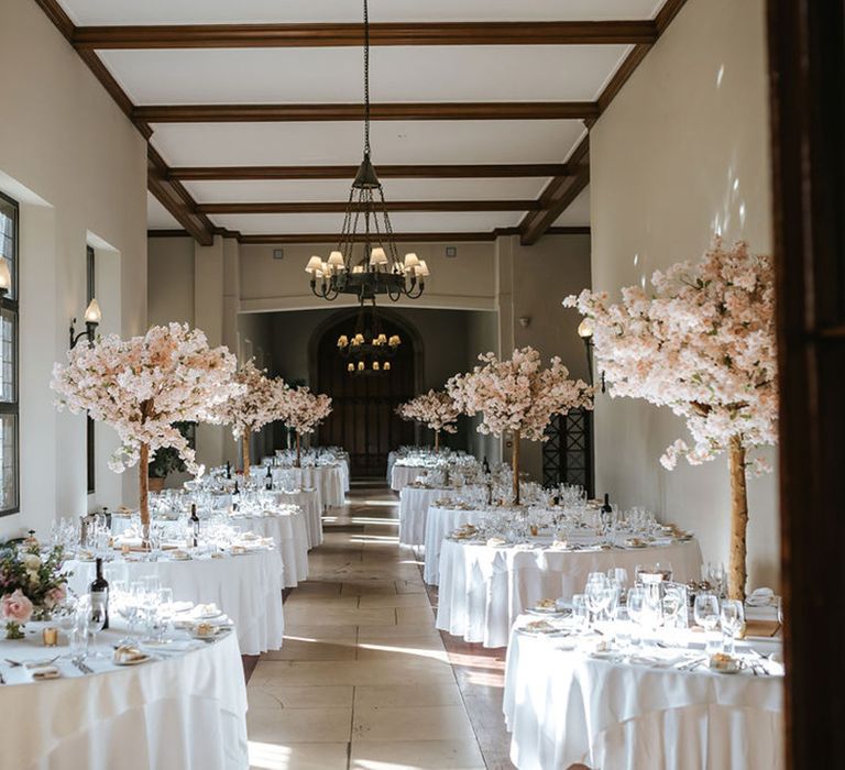 Pink blossom tree wedding table centrepiece at Ashridge House wedding venue 