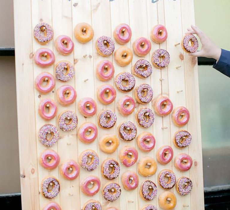 Doughnut wall at wedding for guests food and drink options