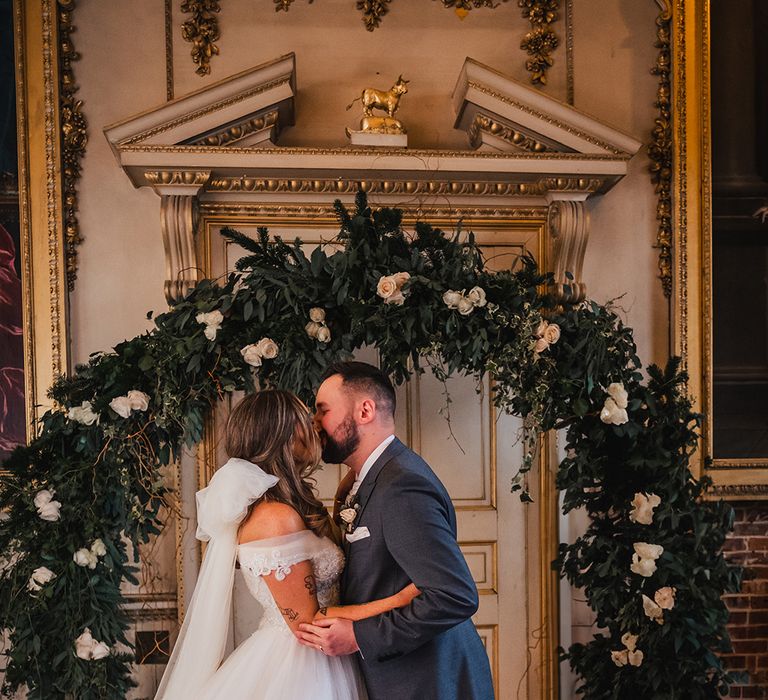 White flower arch altar decoration with bride and grooat luxe country house wedding 