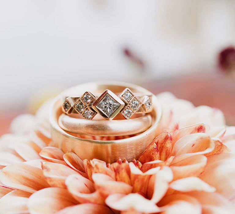 Rose gold diamond engagement ring with his and hers wedding bands 