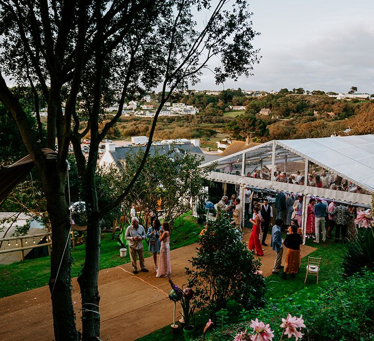 Glass marquee wedding reception at coastal wedding in Jersey 