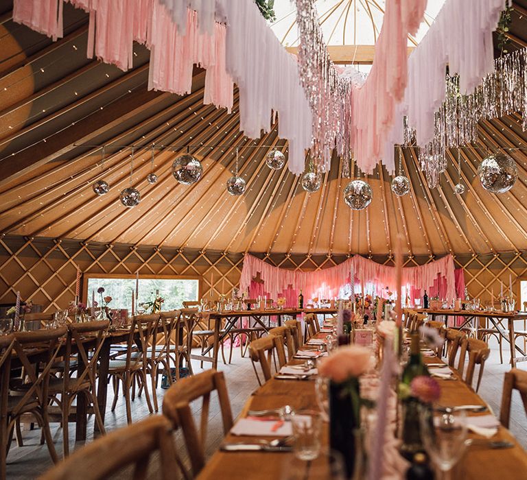 Pink streamers and disco balls at Thorpe Garden wedding venue 