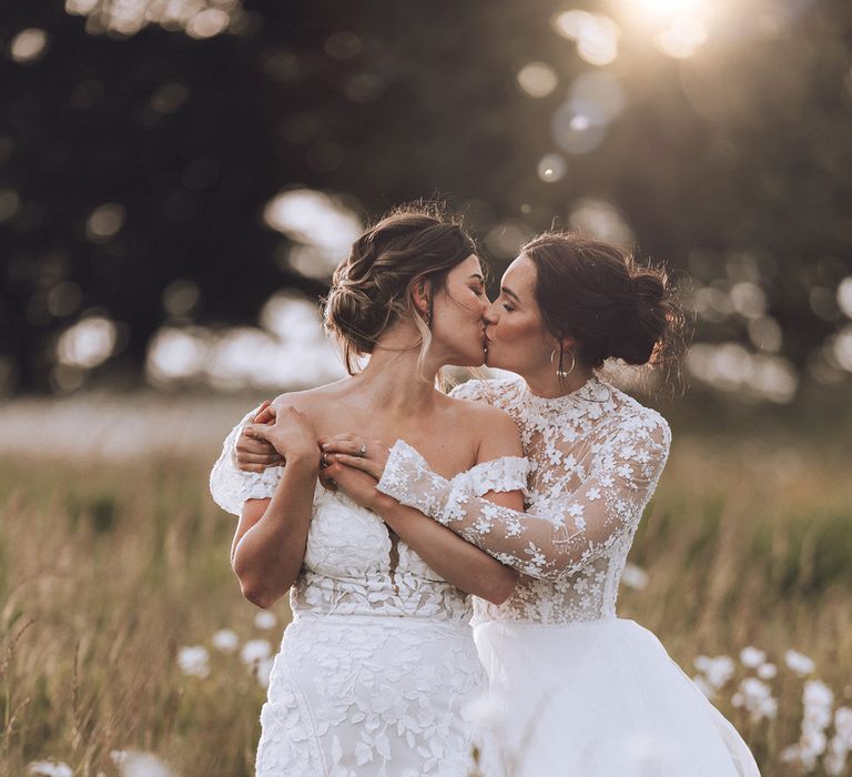 Two brides at Stone Barn same sex wedding with golden hour 