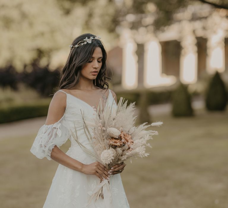 Boho bride in cold shoulder lace wedding dress 