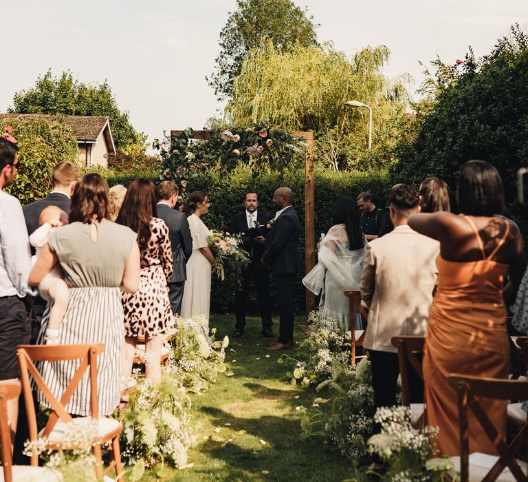 Bride and groom exchanging vows as CS Lewis House in Oxford 