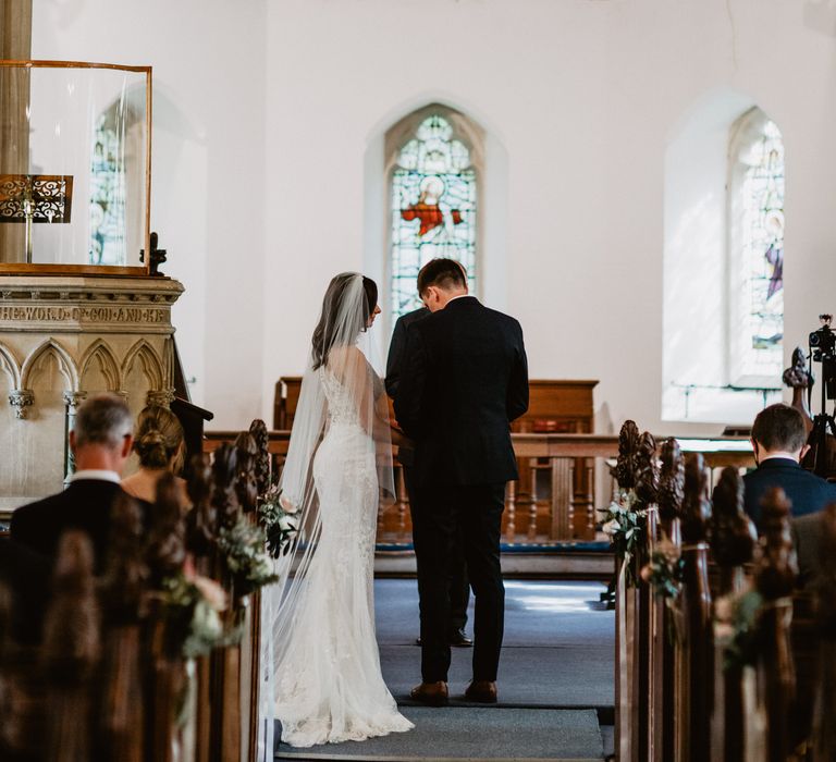 Bride & groom during church wedding ceremony