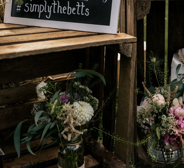 Chalkboard wedding signage on wooden box 