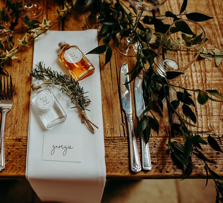 Table decor with brown string tied rosemary 