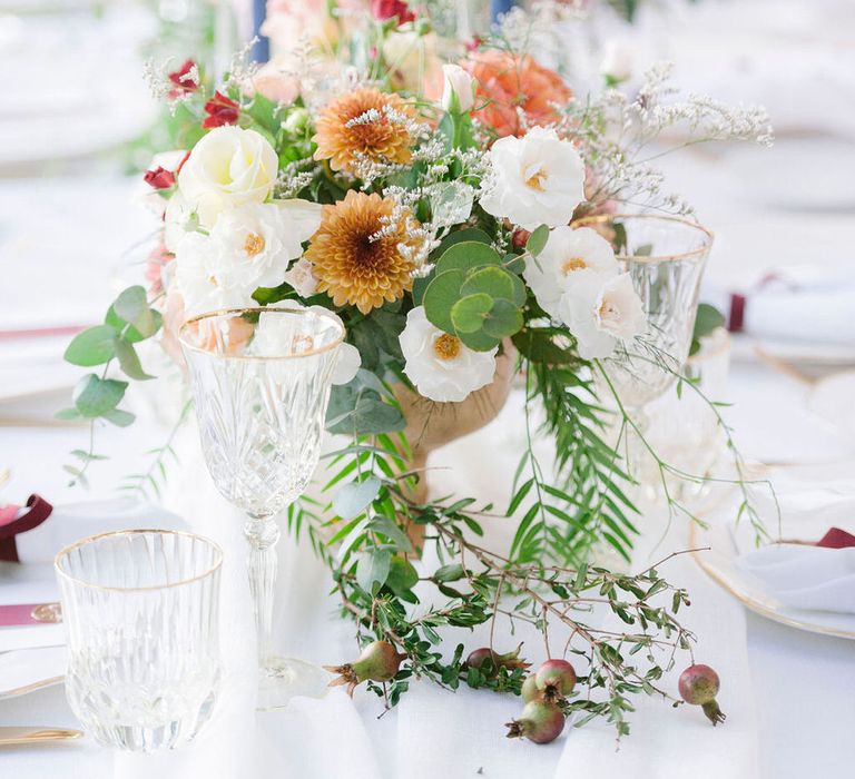 Terracotta and white floral centrepieces for an outdoor Italian wedding