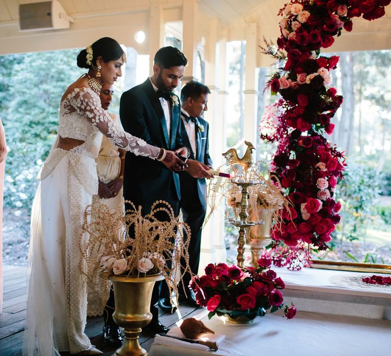 Bride & groom cut their cake on their wedding day