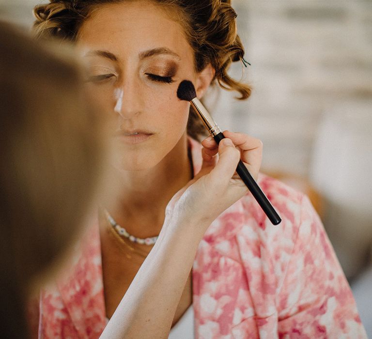 Bride has her makeup done on the morning of her wedding day in Croatia